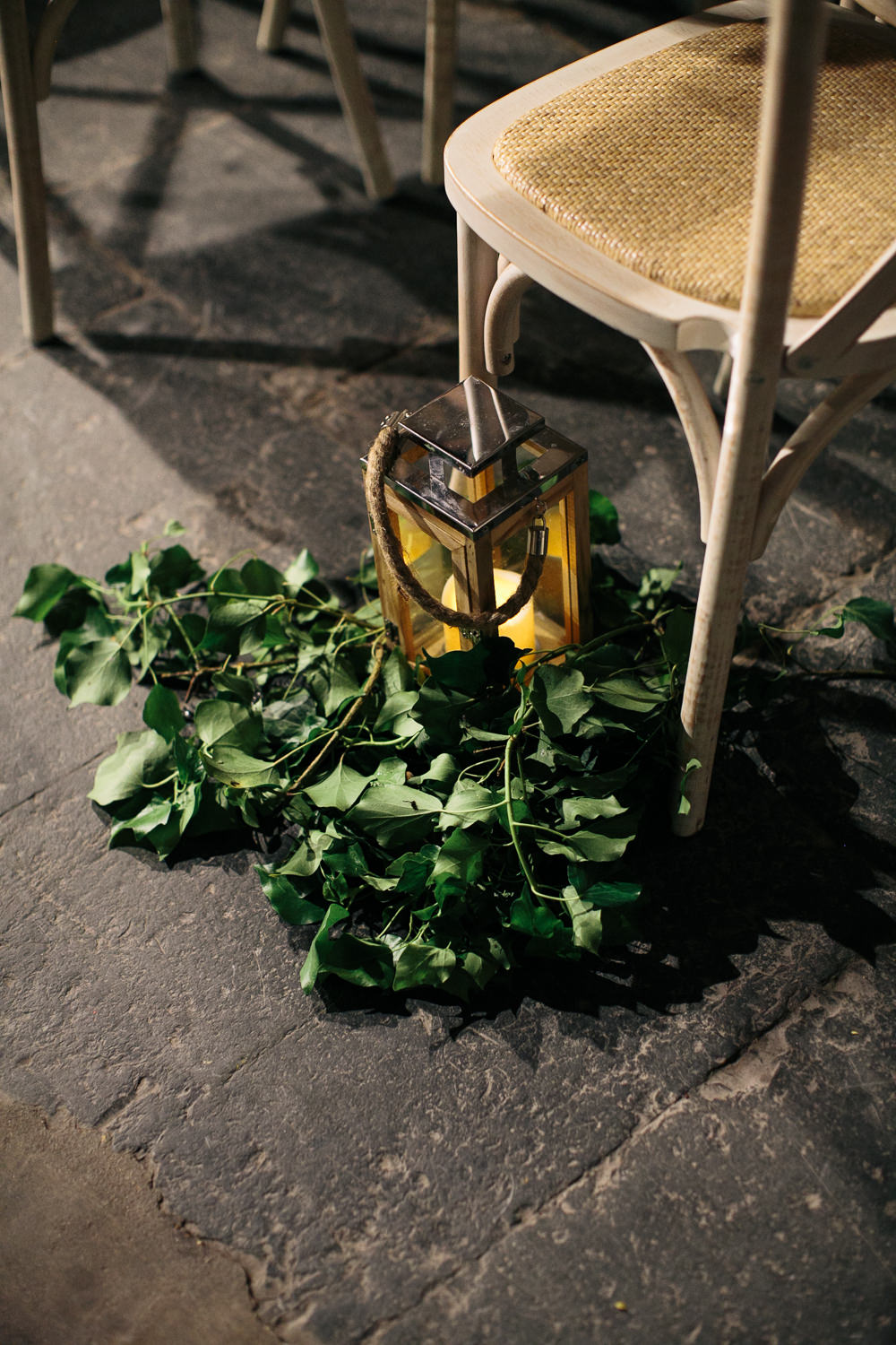 Cross Back Chairs Hurricane Candles Foliage Greenery Aisle Ceremony Bridal Jumpsuit Wedding Emily Jarrett Photography