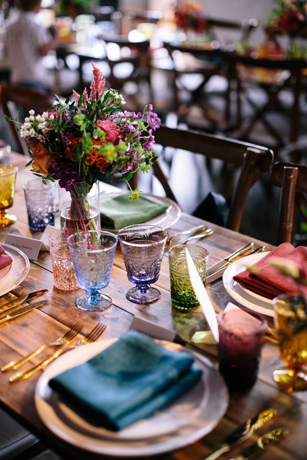 Long Tables Wooden Cross Back Chairs Colourful Lanterns Flowers Napkins Bridal Jumpsuit Wedding Emily Jarrett Photography
