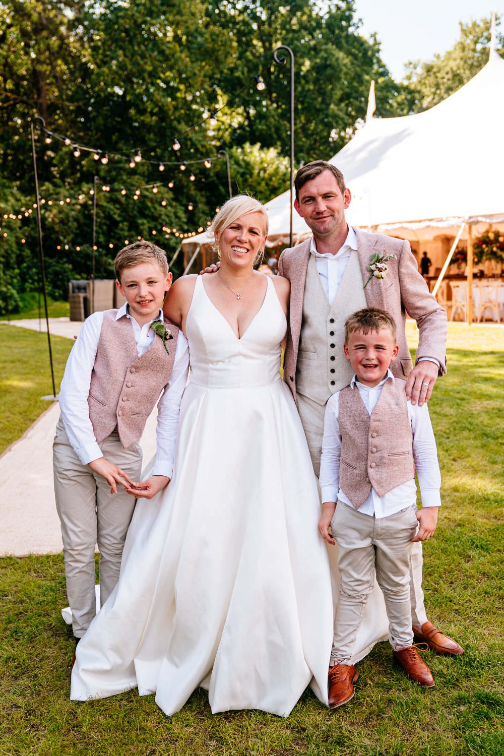 Bride Bridal V Neck Justin Alexander Dress Gown A Line Pink Salmon Custom Suit Groom Page Boys Matching Waistcoats Carousel Wedding Sarah Legge Photography