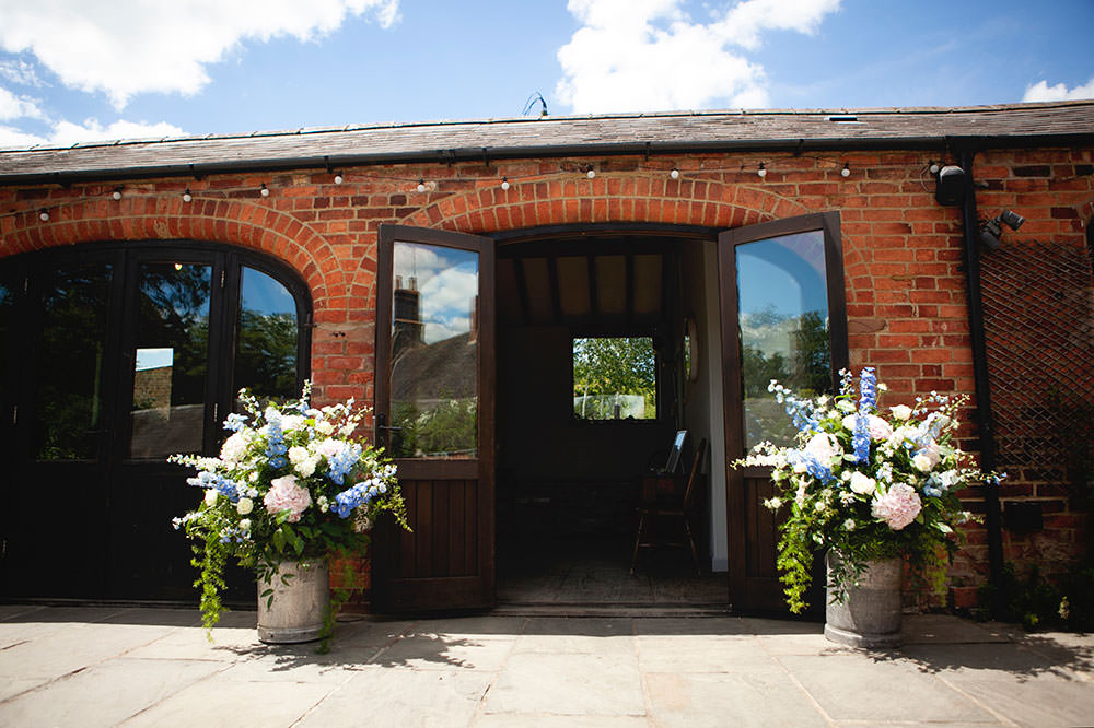 Milk Churns Flowers Floral Stocks Countryside Barn Wedding Katrina Matthews Photography
