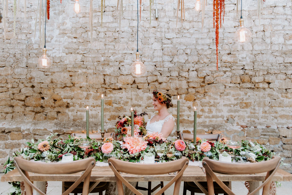 Table Tablescape Decor Decoration Autumn Fall Flowers Wooden Long Candles Dahlia Coral Greenery Suspended Hanging Flowers Foliage Light Bulbs Lighting Ethical Wedding Ideas Sadie Osborne Photography