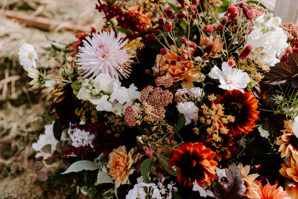 Flowers Flower Arrangement Fall Autumn Coral Pink Greenery Foliage Dahlia Ethical Wedding Ideas Sadie Osborne Photography