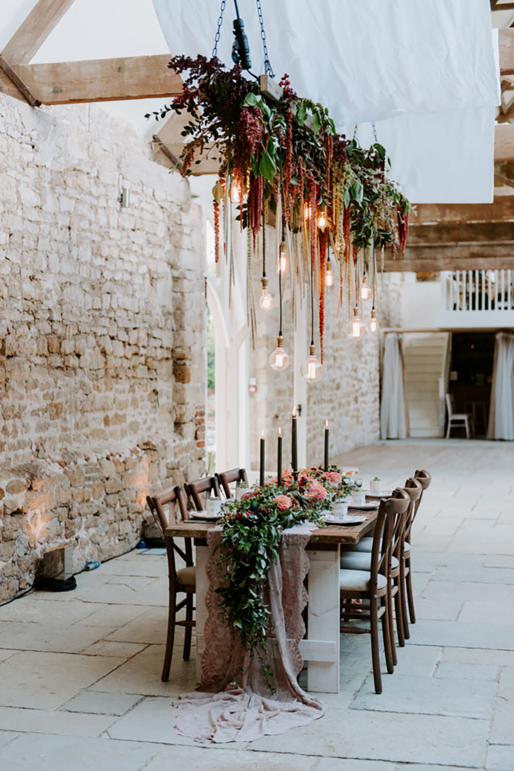 Table Tablescape Decor Decoration Autumn Fall Flowers Wooden Long Candles Dahlia Coral Greenery Suspended Hanging Flowers Foliage Light Bulbs Lighting Ethical Wedding Ideas Sadie Osborne Photography
