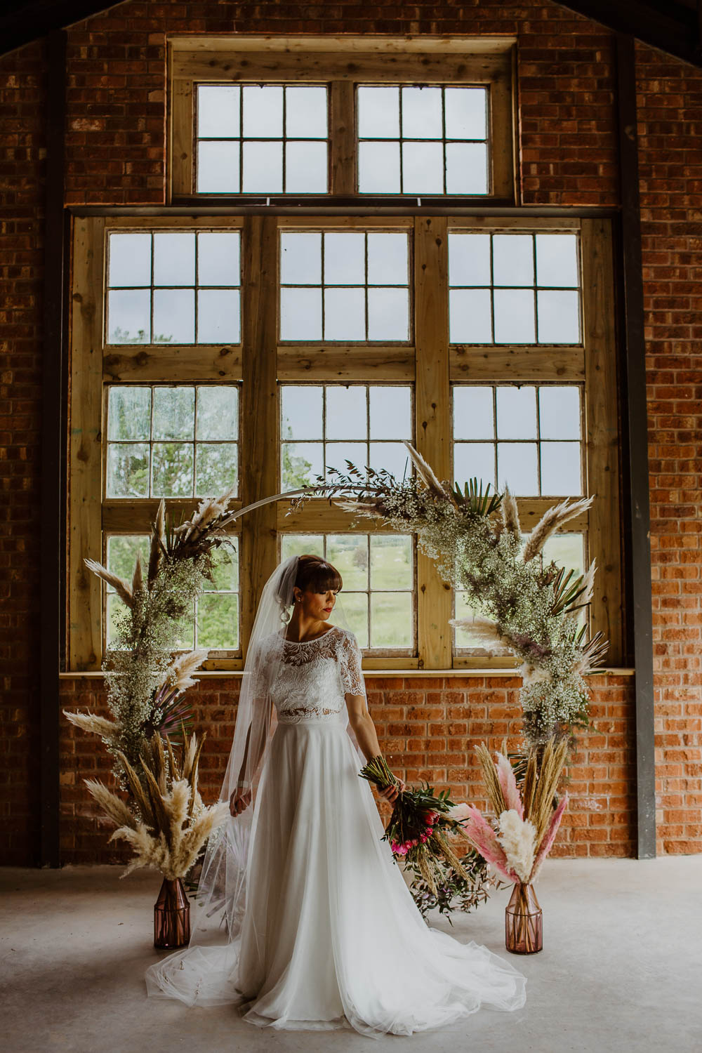 Moon Gate Flower Arch Pampas Grass Backdrop Ceremony Venue Giraffe Shed Wedding When Charlie Met Hannah