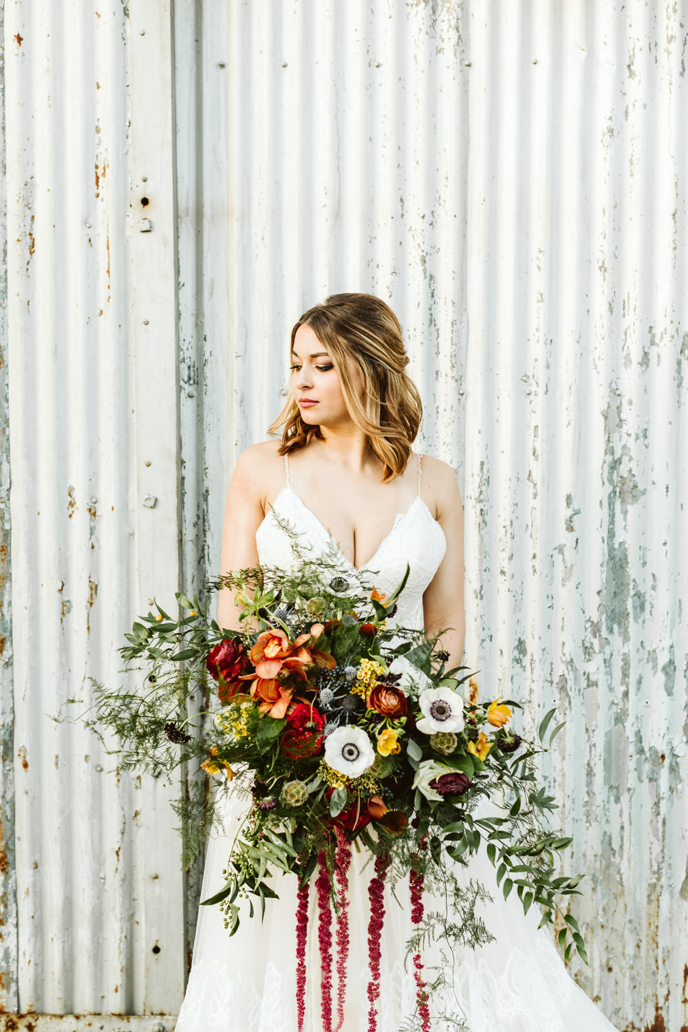Bouquet Flowers Bride Bridal Anemone Amaranthus Ranunculus Greenery Foliage Red Burgundy Halloween Wedding Ideas Megan Morales Photography