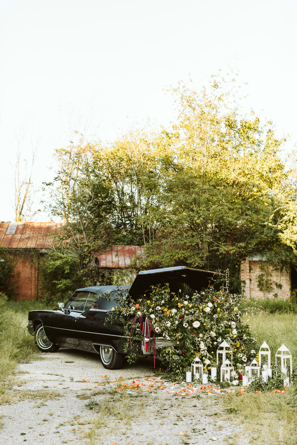 Car Transport Candles Flowers Centrepiece Anemone Amaranthus Ranunculus Greenery Foliage Red Burgundy Halloween Wedding Ideas Megan Morales Photography
