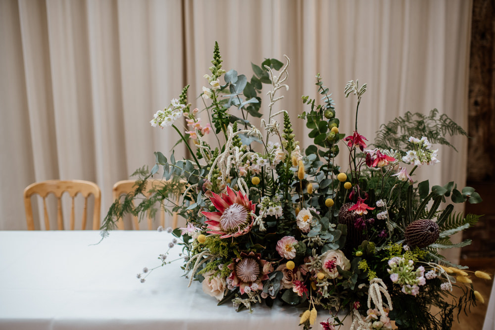Table Flowers Arrangement King Protea Greenery Foliage Wild Henry Moore Wedding Ellie Gillard Photography
