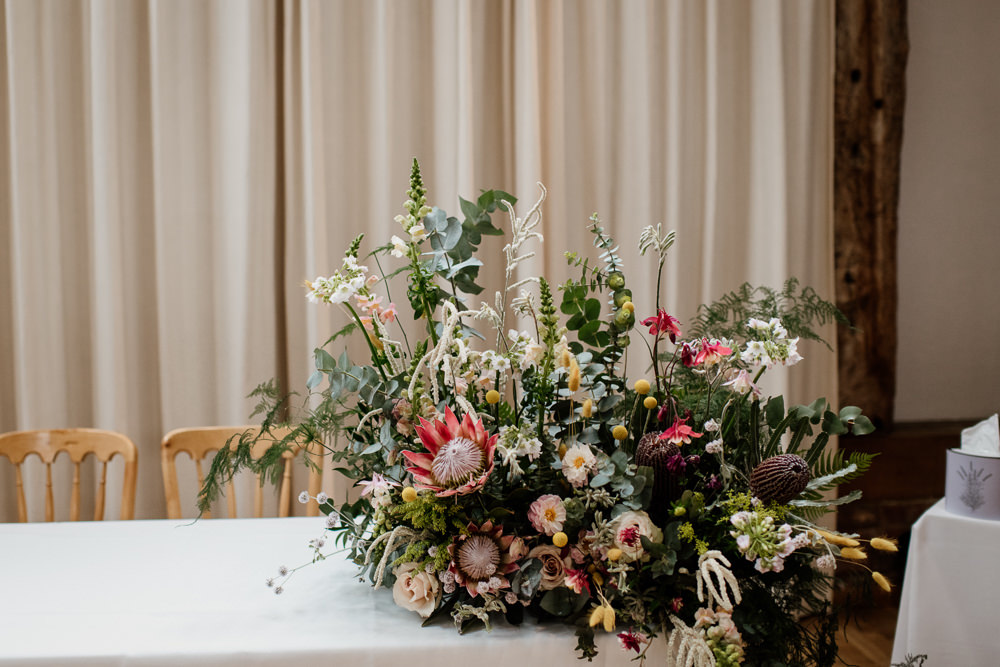 Table Flowers Arrangement King Protea Greenery Foliage Wild Henry Moore Wedding Ellie Gillard Photography