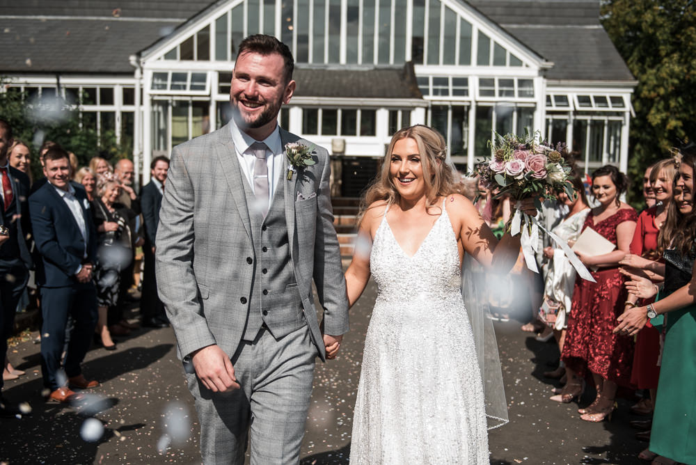 Bride Bridal Strappy Sparkly Sequin V Neck White ASOS Dress Gown Grey Checked Suit Three Piece Waistcoat Groom Bouquet Confetti Hexham Winter Gardens Wedding Leighton Bainbridge Photography