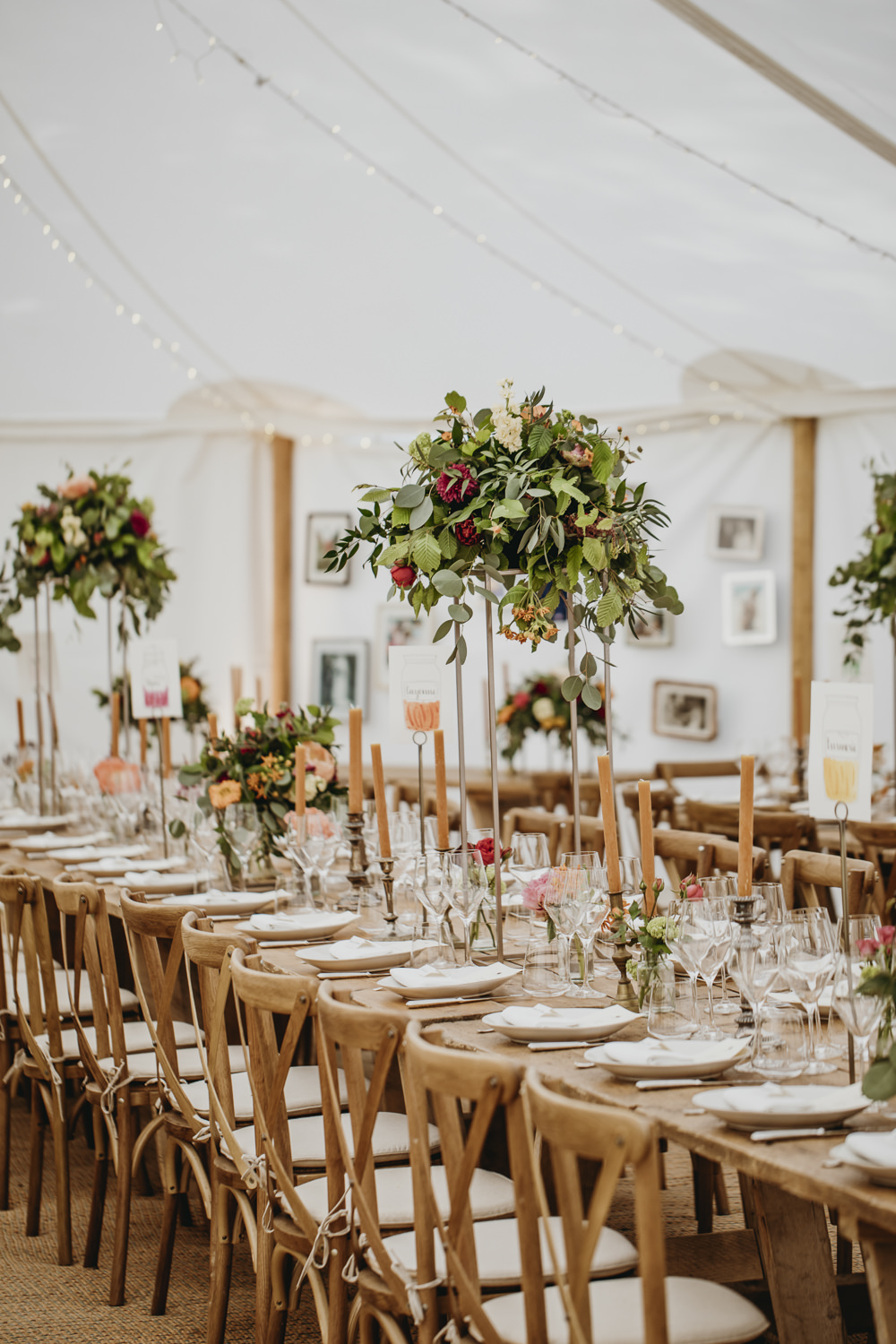 Long Wooden Tables Cross Back Chairs Tall Flowers Arrangements Centrepiece Greenery Foliage Kent Marquee Wedding Lily Bungay and Co