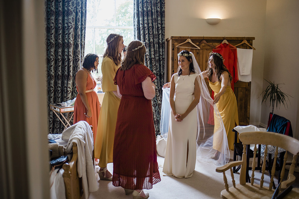 Bride Bridal Boat Neck Cut Out Dress Gown Flower Floral Crown Veil Mismatched Yellow Orange Bridesmaids Marquee Castle Wedding Rachael Fraser Photography