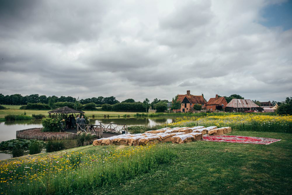 Outdoor Ceremony Persian Rugs Hay Bales Pink Red Wedding Three Flowers Photography