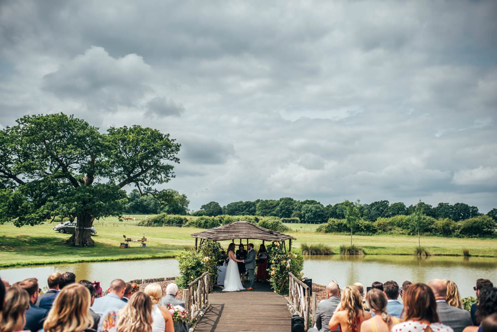 Outdoor Ceremony Persian Rugs Hay Bales Pink Red Wedding Three Flowers Photography