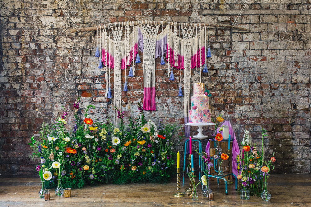 Cake Table Meadow Flowers Macrame Backdrop Candles Meadowscape Arrangement Wild Colourful Poppy Poppies Playful Cool Wedding Ideas Sophie Lake Photography