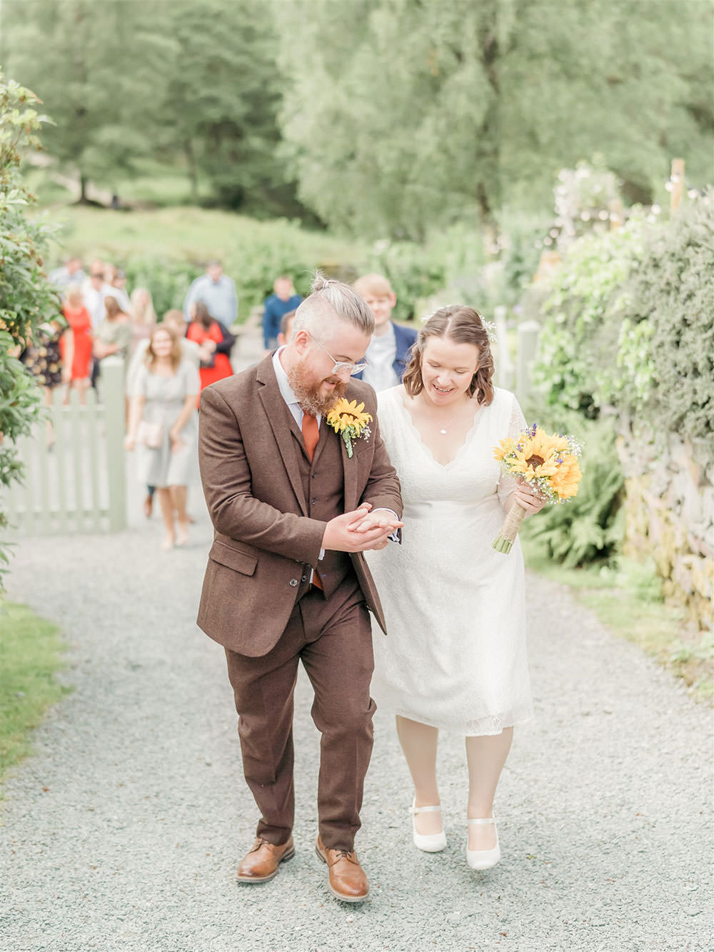 Bride Bridal Long Sleeve Tea Length Dress Lace Slaters Tweed Three Piece Suit Waistcoat Groom Sunflower Bouquet Surprise Wedding Carn Patrick Photography