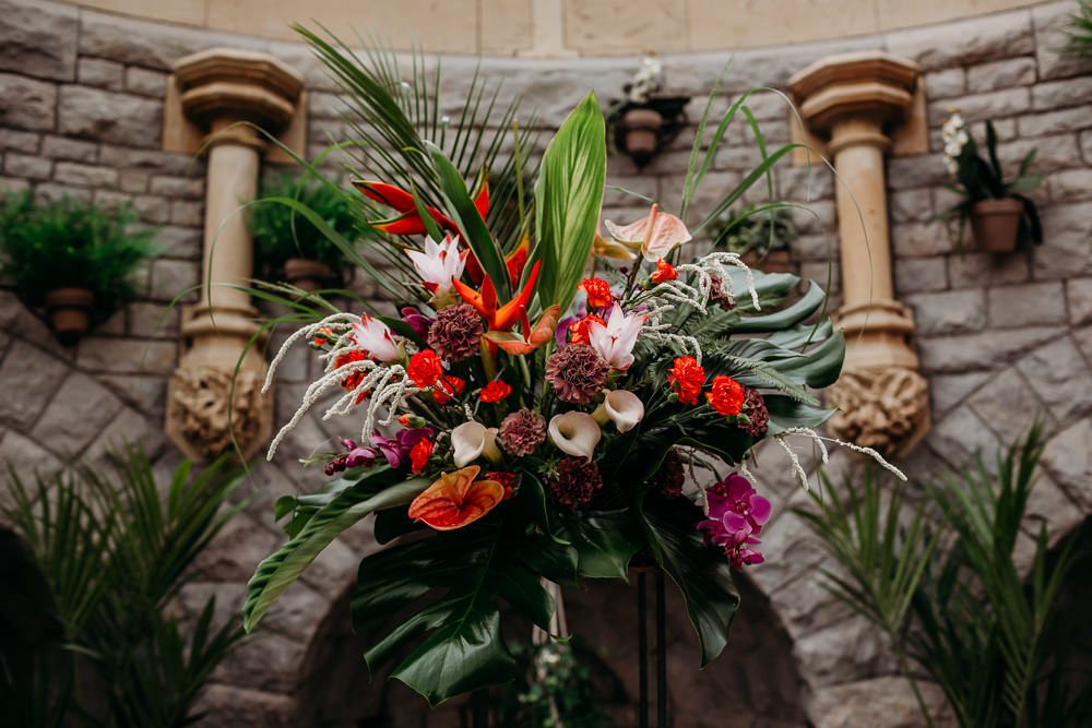 Flower Arrangement Tall Centrepiece Metal Palm Leaf Birds of Paradise Protea Hanging Orchids Anthurium Tropical Wedding Ideas When Charlie Met Hannah
