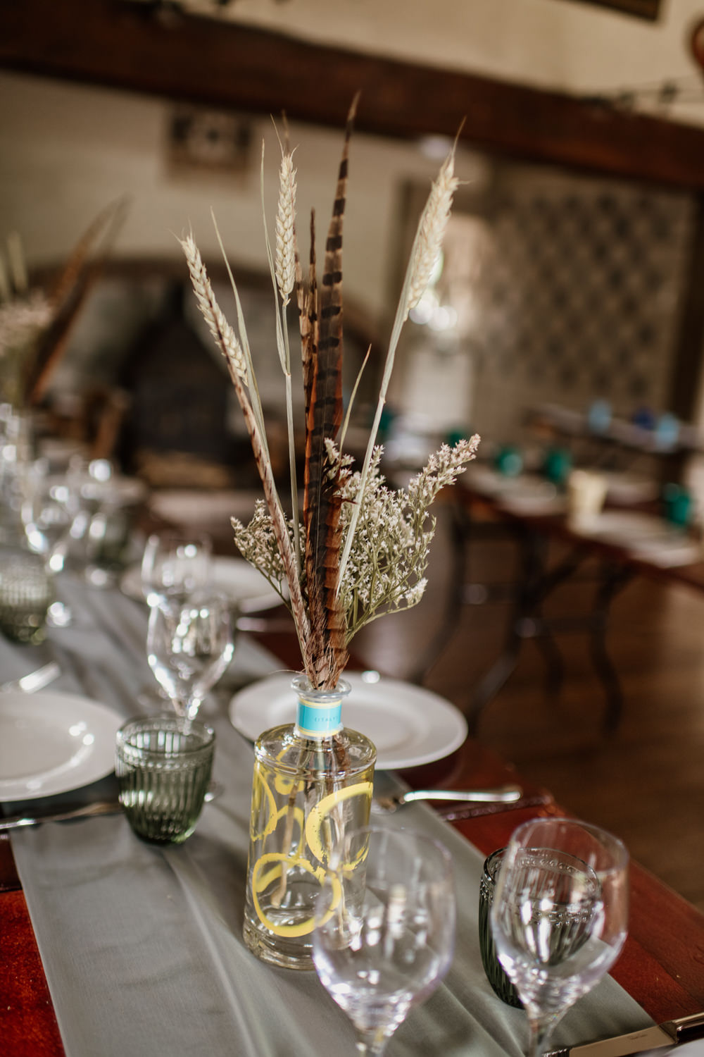 Grass Wheat Feather Table Centrepiece Flowers Bottles Decor Voewood Wedding Ellie Gillard Photography