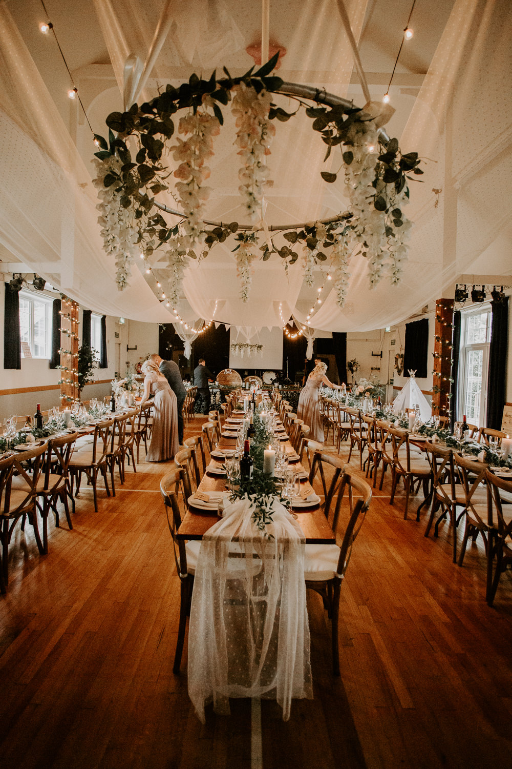 Floral Hoop Hanging Chandelier Draping Ceiling Willingale Village Hall Wedding Photographer Liam Gillan