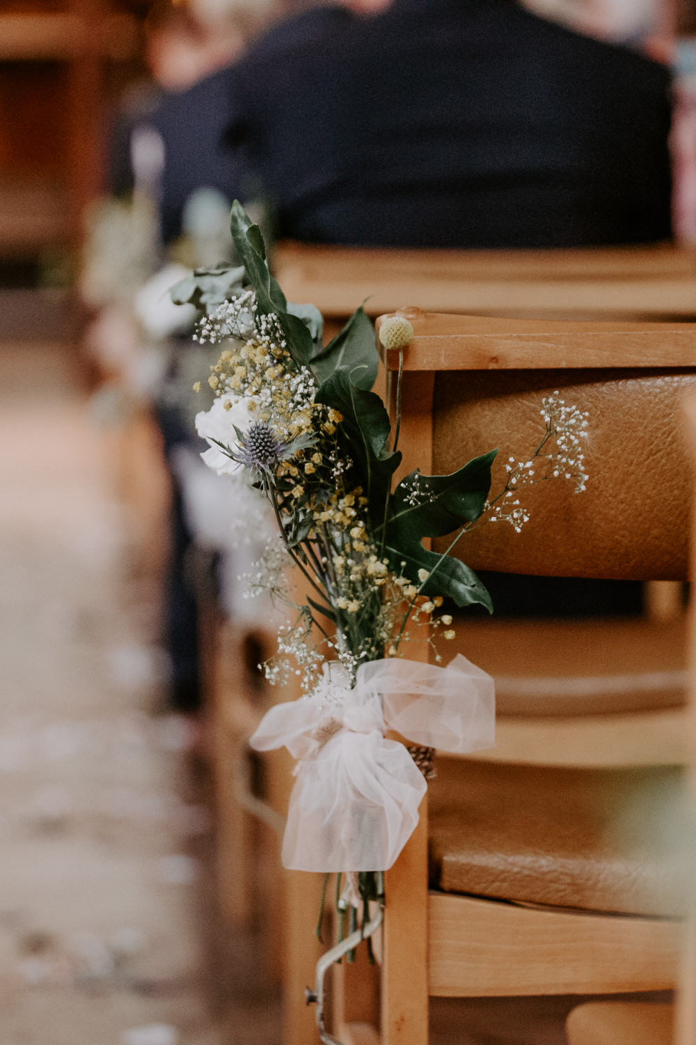 Sea Holly Thistle Greenery Pew Ends Aisle Flowers Willingale Village Hall Wedding Photographer Liam Gillan