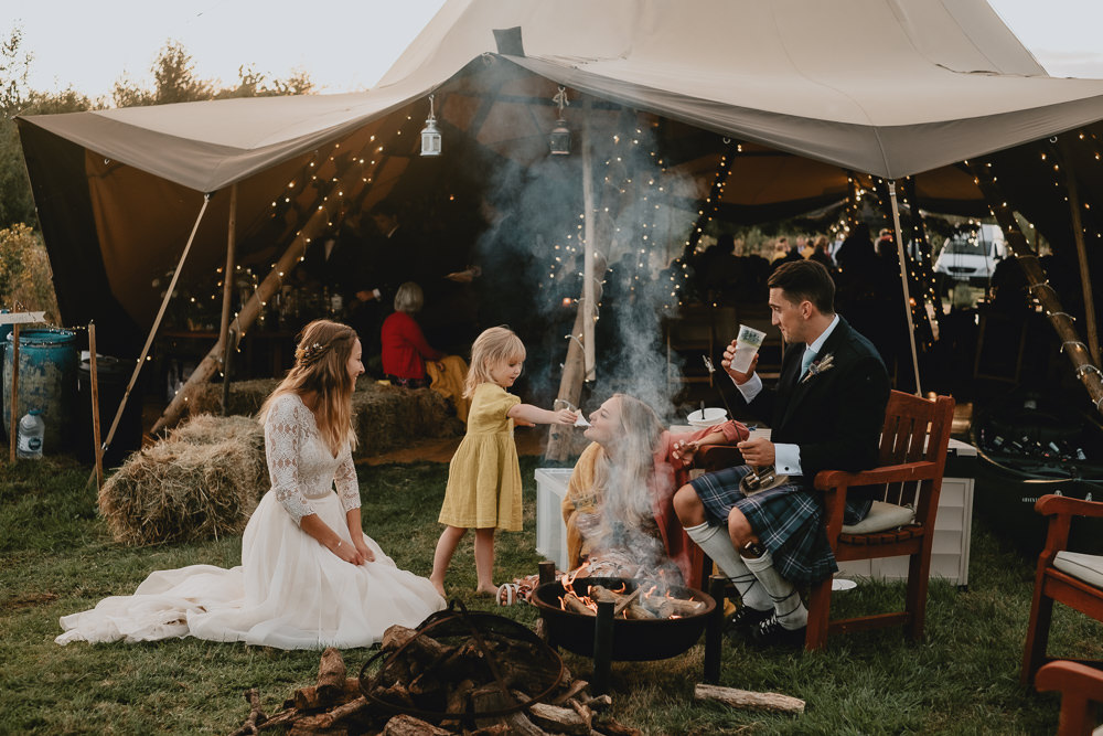 Bride Bridal V Neck Lace Long Sleeve Dress Gown Ribbon Belt Kilt Groom Dried Flower Wheat Bouquet Fire Pit Woodland Tipi Wedding Caroline Goosey Photography