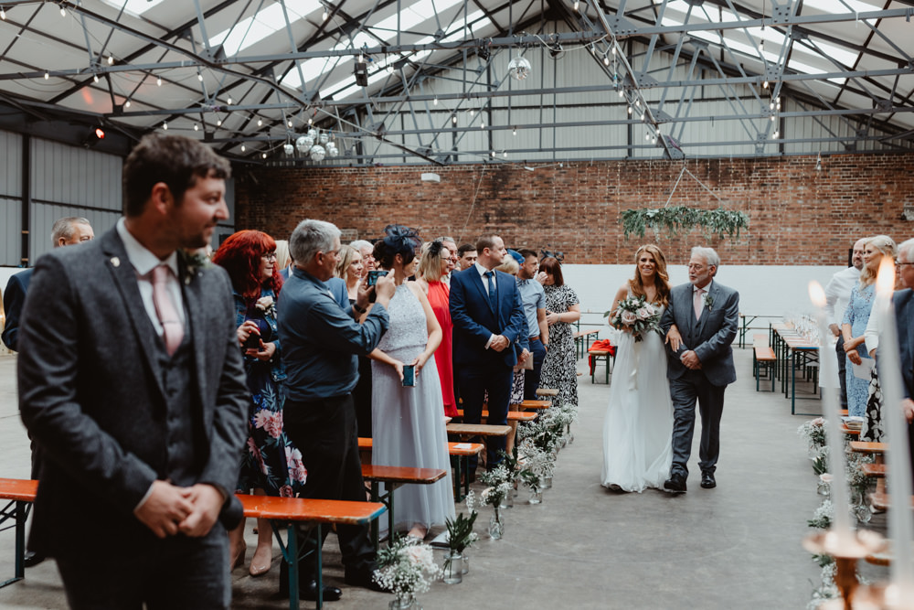 Ceremony Venue Industrial Warehouse Benches Flowers Aisle Pew End 92 Burton Road Wedding Stevie Jay Photography