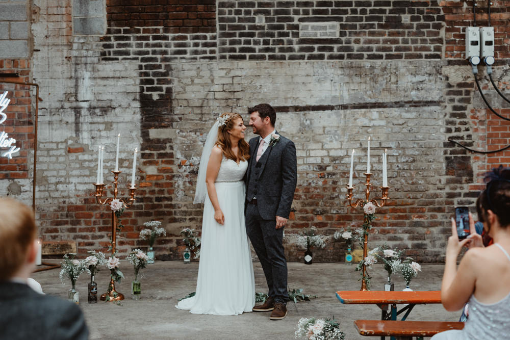 Ceremony Venue Industrial Warehouse Benches Flowers Aisle Pew End 92 Burton Road Wedding Stevie Jay Photography