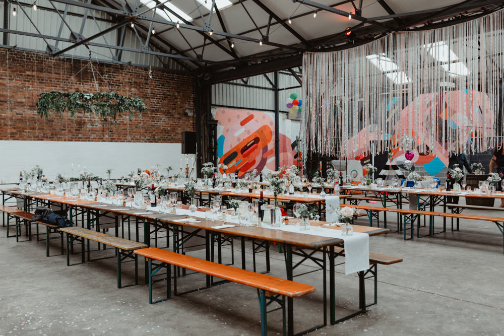 Reception Venue Industrial Warehouse Benches Long Tables Flowers Decor Decoration Runners Festoon Lights 92 Burton Road Wedding Stevie Jay Photography