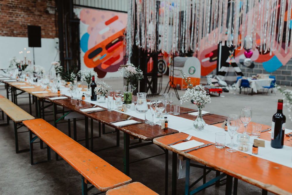 Reception Venue Industrial Warehouse Benches Long Tables Flowers Decor Decoration Runners Festoon Lights 92 Burton Road Wedding Stevie Jay Photography