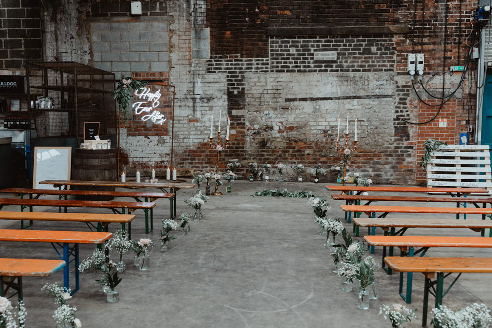 Ceremony Venue Industrial Warehouse Benches Flowers Aisle Pew End 92 Burton Road Wedding Stevie Jay Photography