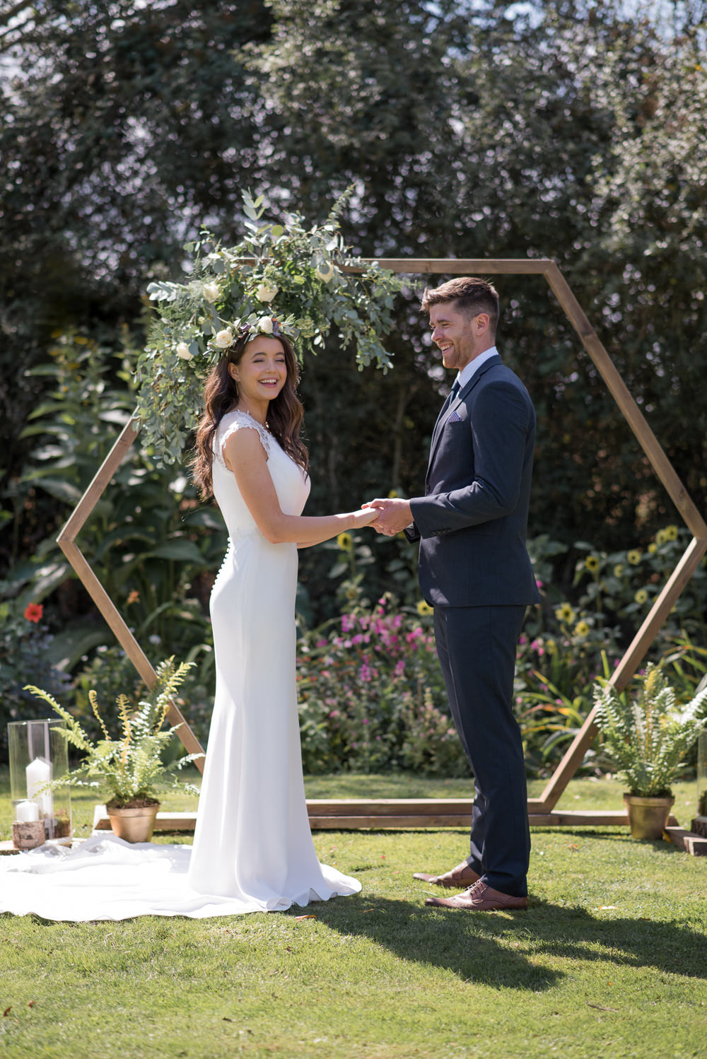 Geometric Backdrop Greenery Foliage Flowers Arch Ceremony Aisle Hexagon Minimalist Wedding Ideas Nicola Belson Photography