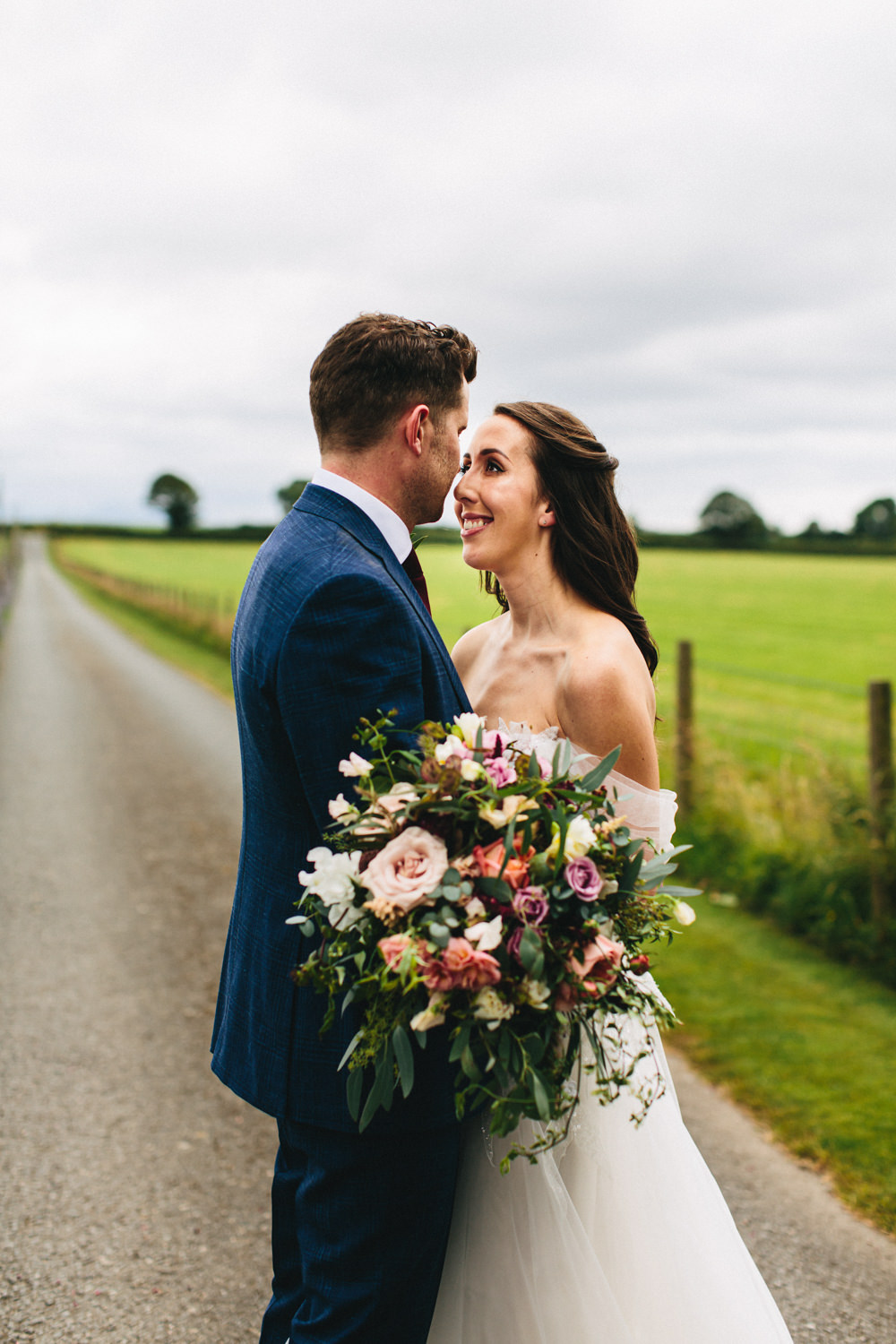 Bouquet Flowers Bride Bridal Greenery Foliage Sweetpeas Freesias Peony Rose Burgundy Pink Outbuildings Wedding Jessica O'Shaughnessy Photography