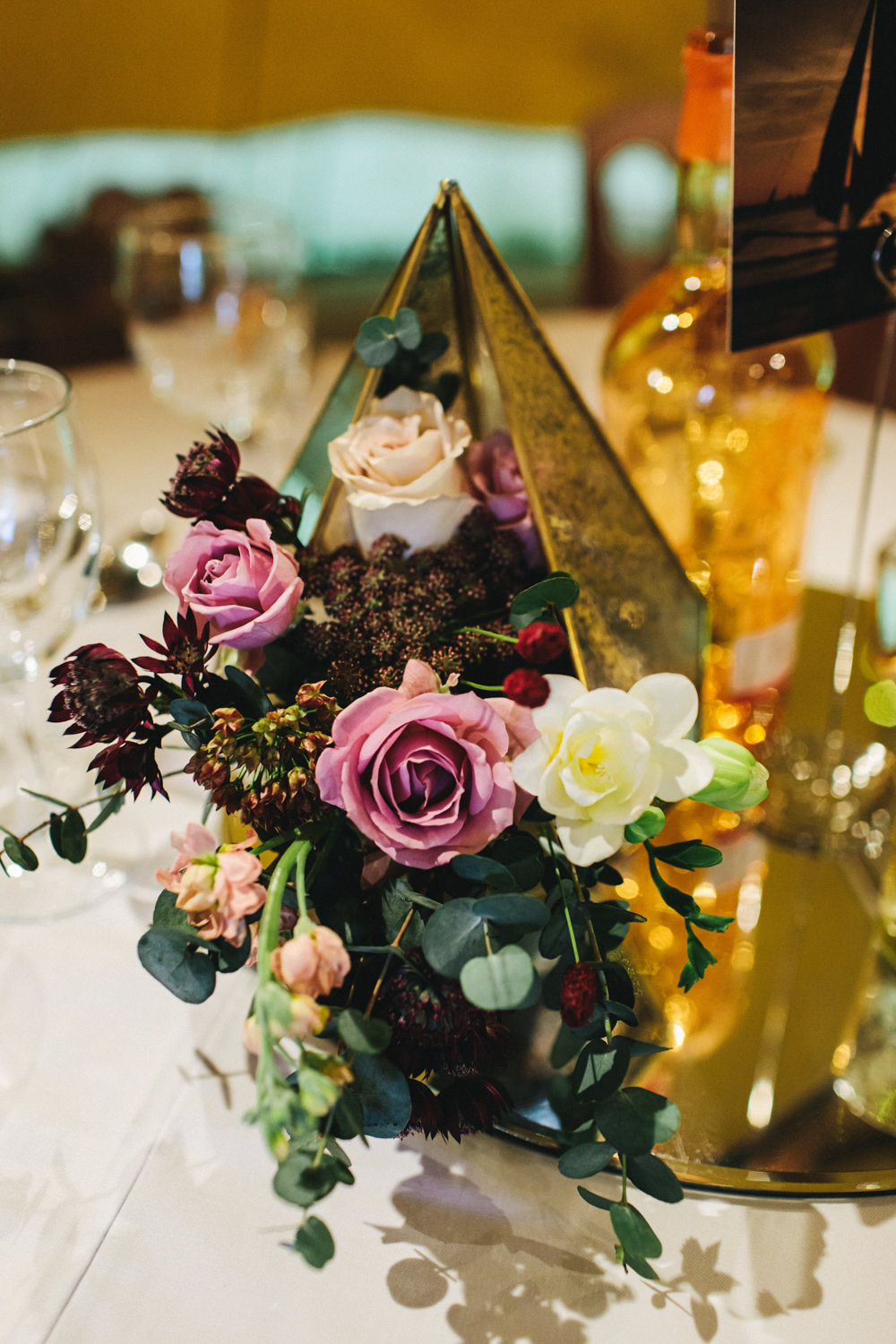 Terrarium Flowers Table Centrepiece Flowers Greenery Foliage Sweetpeas Freesias Peony Rose Burgundy Pink Outbuildings Wedding Jessica O'Shaughnessy Photography