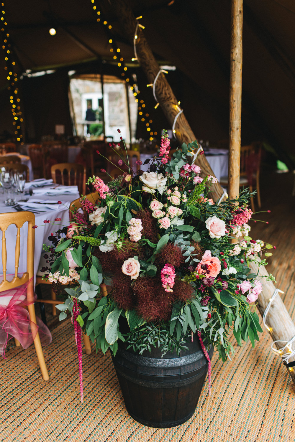 Flower Arrangement Barrel Pink Red Greenery Foliage Outbuildings Wedding Jessica O'Shaughnessy Photography