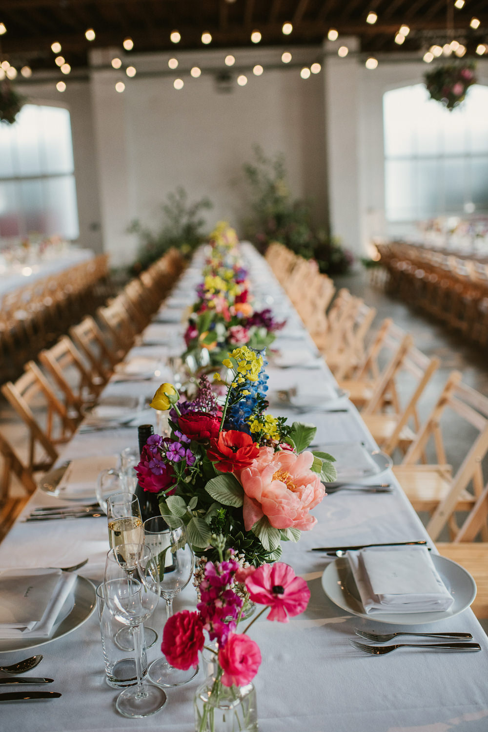 Bottle Flowers Table Decor Centrepiece Spring Coral Peony Natural Wild Colourful Long Table Riverside London Wedding Ellie Gillard Photography
