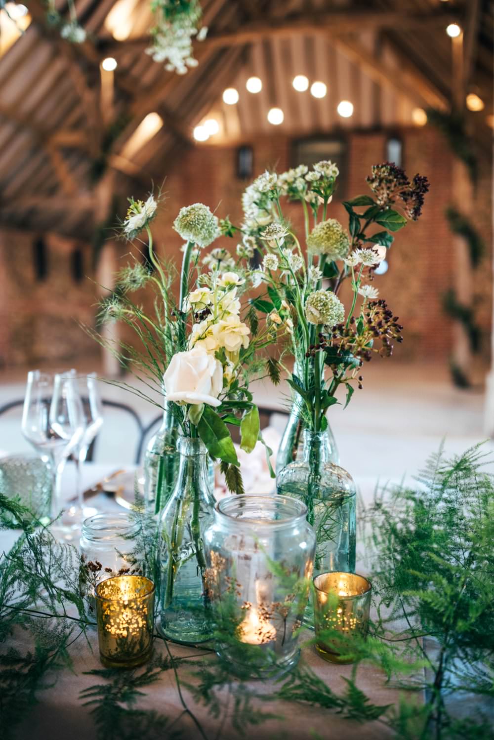 Bottle Flowers Centrepiece Decor Foliage Greenery Candles Tuffon Hall Wedding Three Flowers Photography
