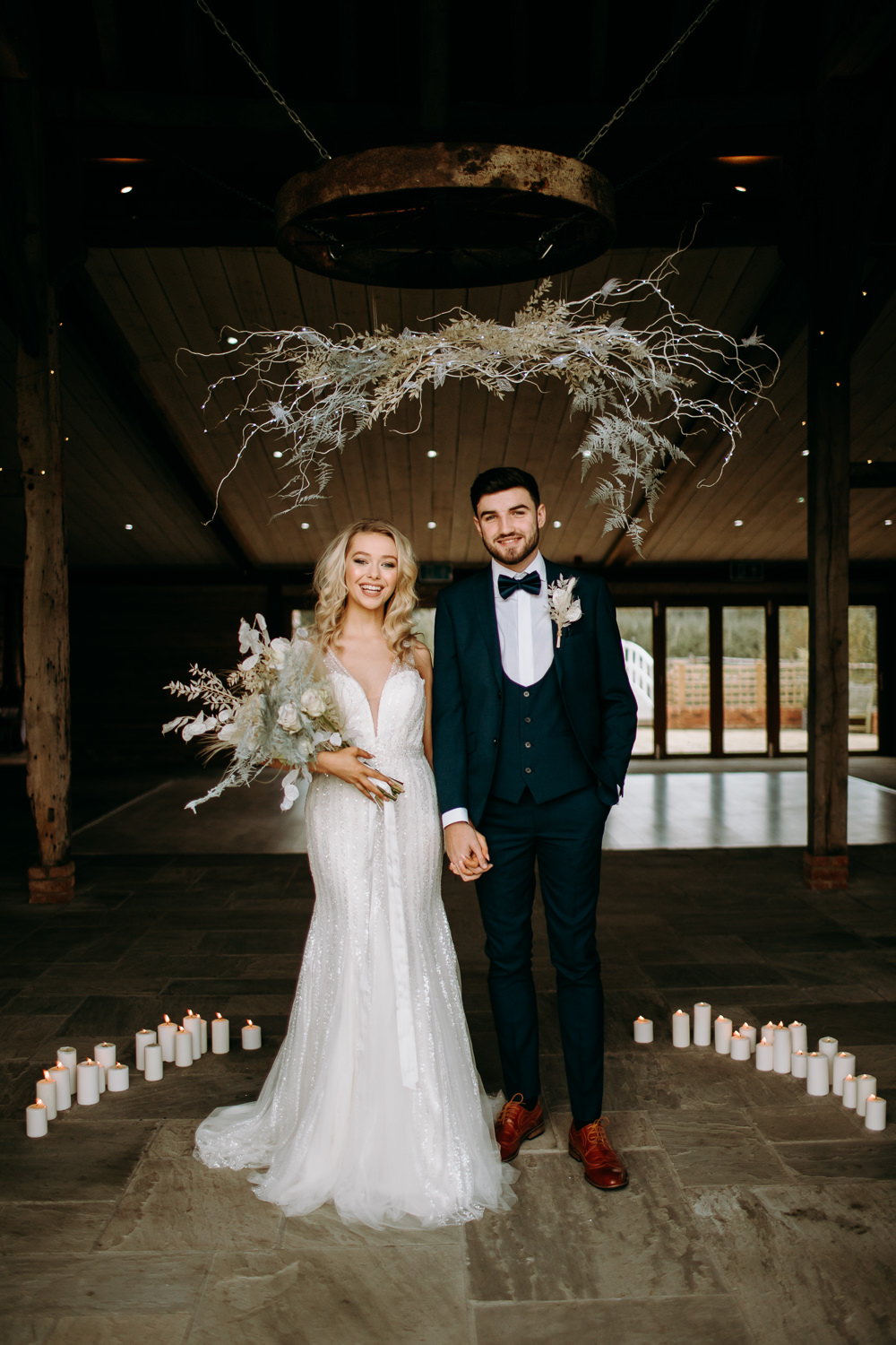 Celestial Wedding Ideas Christine Thirdwheeling Backdrop Ceremony Flower Cloud Installation Grass Foliage Candles Groom Suit Bow Tie 