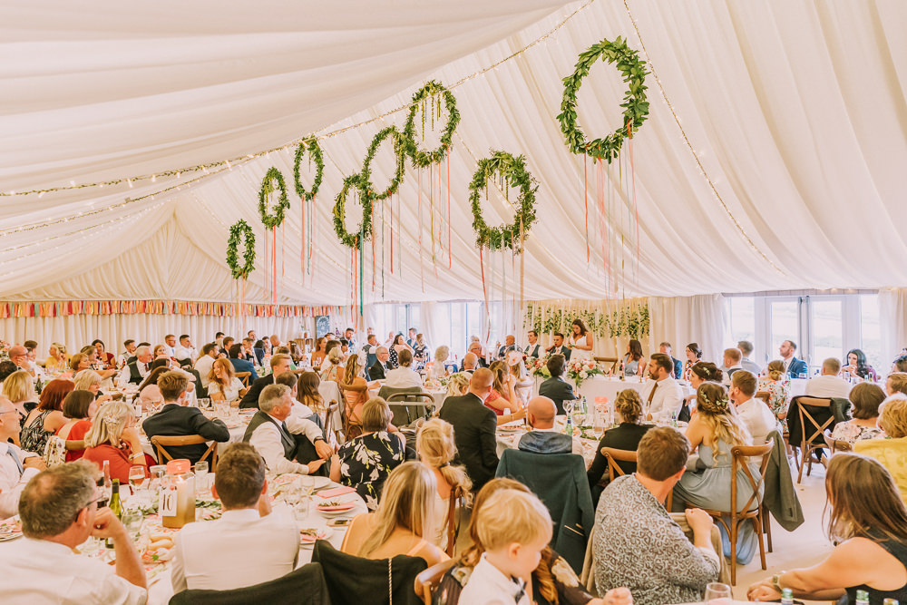 Marquee Hanging Wreaths Hoops Suspended Greenery Foliage Ribbon Fairy Lights Crafty Village Hall Wedding Dot and Scolly Photography