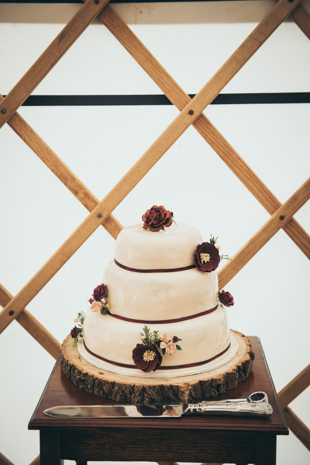 Iced Cake Burgundy Flowers Log Stand Fron Farm Yurt Retreat Wedding Cat Arwel Photography