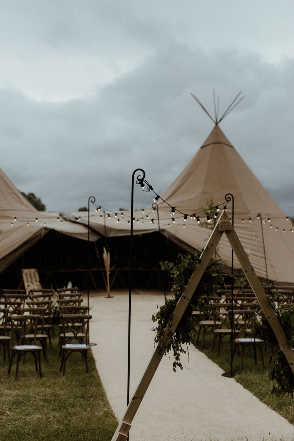 Tipi Festoon Lights Ceremony Reception Outdoor Wedding UK Olivia and Dan Photography