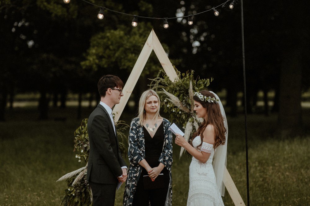 Backdrop Triangle Flowers Festoon Lights Backdrop Ceremony Outdoor Wedding UK Olivia and Dan Photography