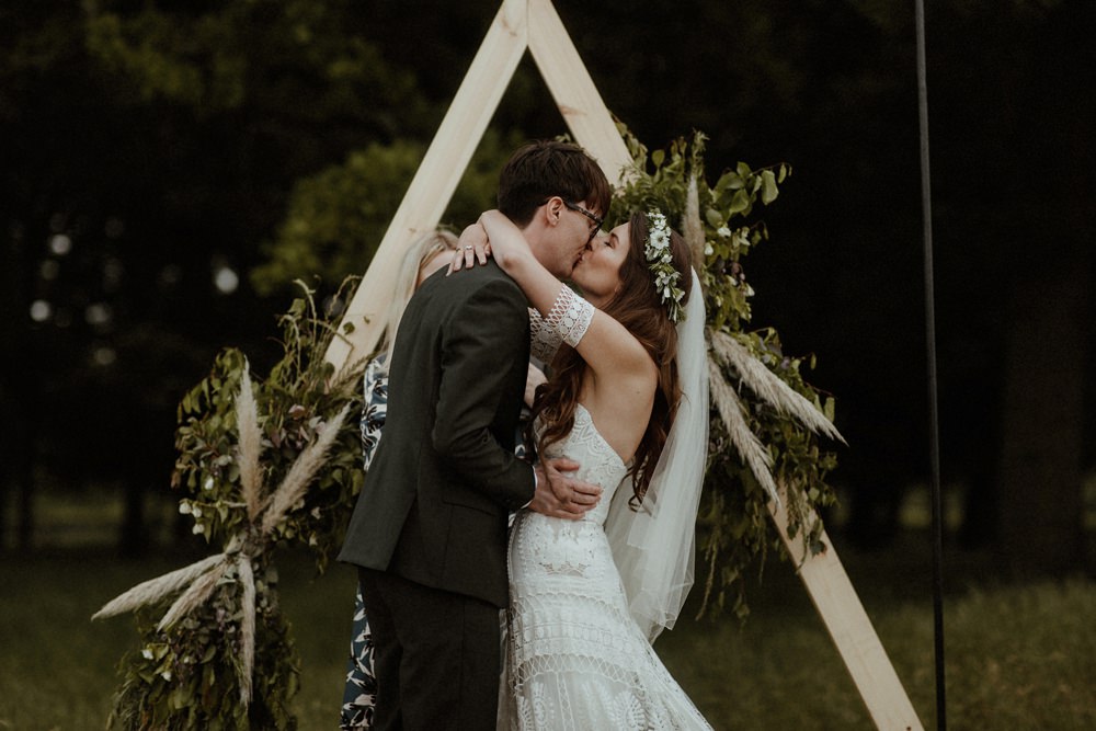 Backdrop Triangle Flowers Festoon Lights Backdrop Ceremony Outdoor Wedding UK Olivia and Dan Photography