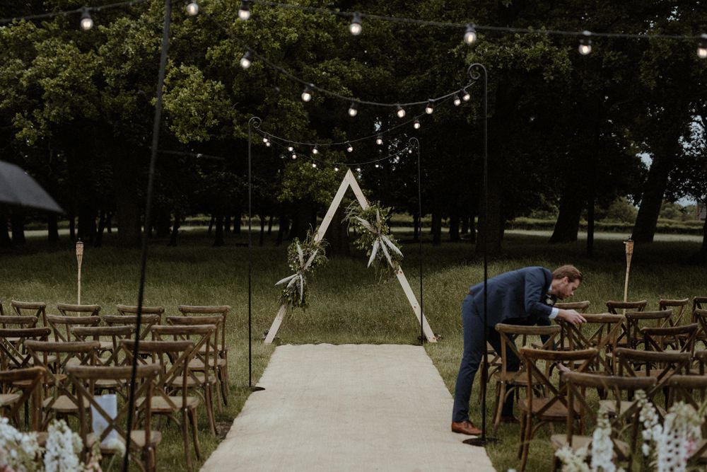 Backdrop Triangle Flowers Festoon Lights Backdrop Ceremony Outdoor Wedding UK Olivia and Dan Photography