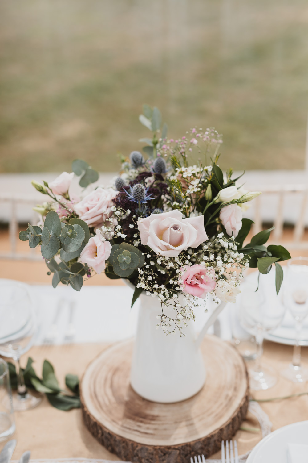 Flowers Jug Rose Thistle Eucalyptus Log Slice Centrepiece Clear Marquee Wedding Sarah Brookes Photography