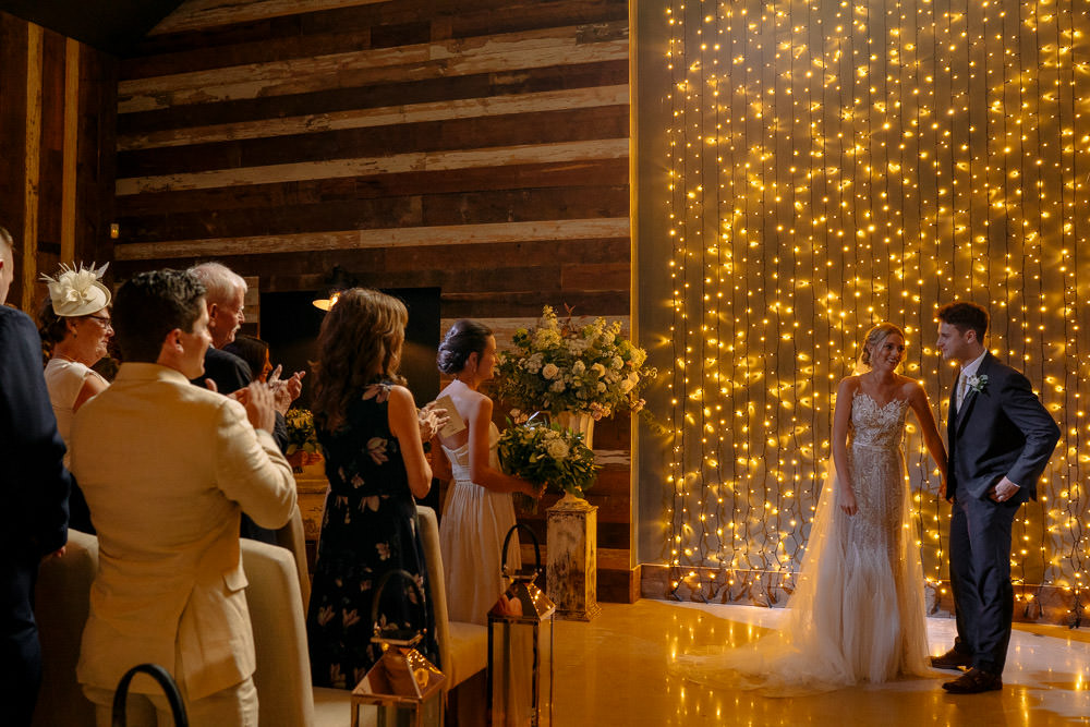 Fariy Lights Backdrop Ceremony Industrial Barn Wedding Toast Of Leeds