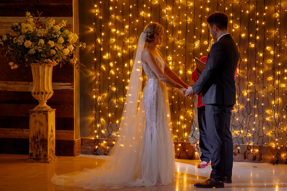 Fariy Lights Backdrop Ceremony Industrial Barn Wedding Toast Of Leeds
