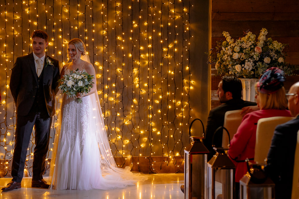 Fariy Lights Backdrop Ceremony Industrial Barn Wedding Toast Of Leeds