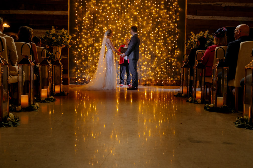 Fariy Lights Backdrop Ceremony Industrial Barn Wedding Toast Of Leeds
