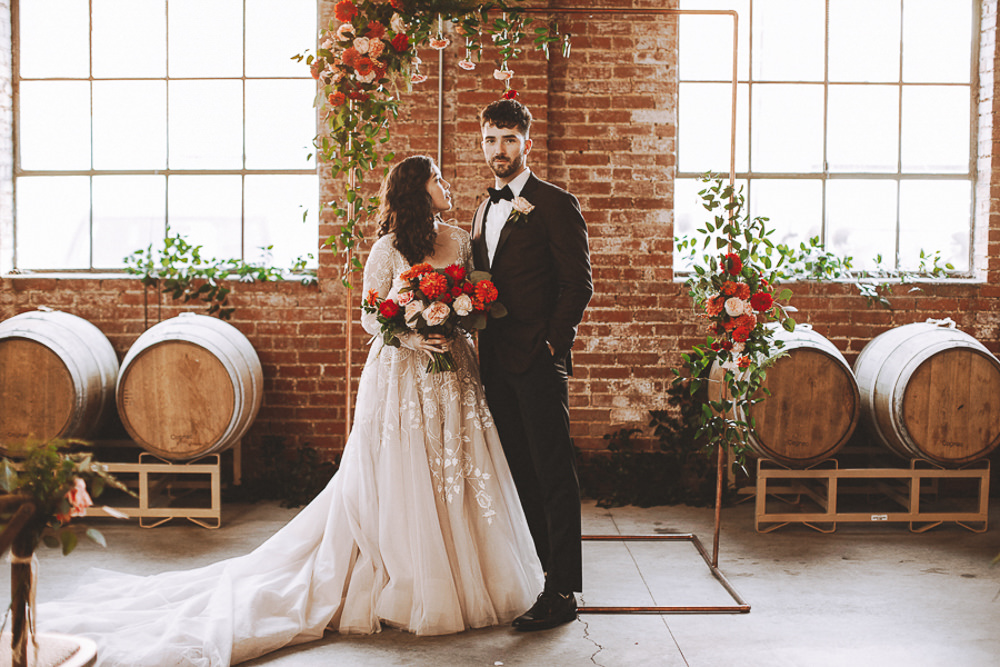 Industrial Distillery Wedding Nessa K Photography Flower Arch Metal Copper Backdrop