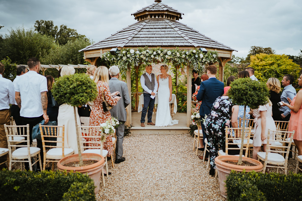 Secret Garden Kent Outdoor Ceremony Gazeebo Pagoda Flowers Greenery Foliage Micro Wedding Nicola Dawson Photography