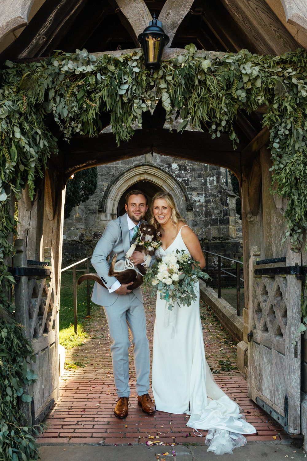 Oak Barn Wedding Matilda Delves Photography Flower Arch Church Greenery Foliage Dog Pet